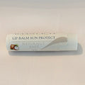 Alta Fauna Naturally Bare (unscented) Lip Balms with Sun Protect on white background.  Texture of lip balm shown. 