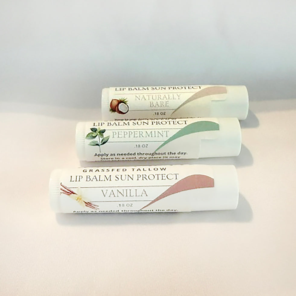 Photo of Alta Fauna's Lip Balm Sun Protect Lip Balm collection in Naturally Bare (unscented), Peppermint and Vanilla on a white background 