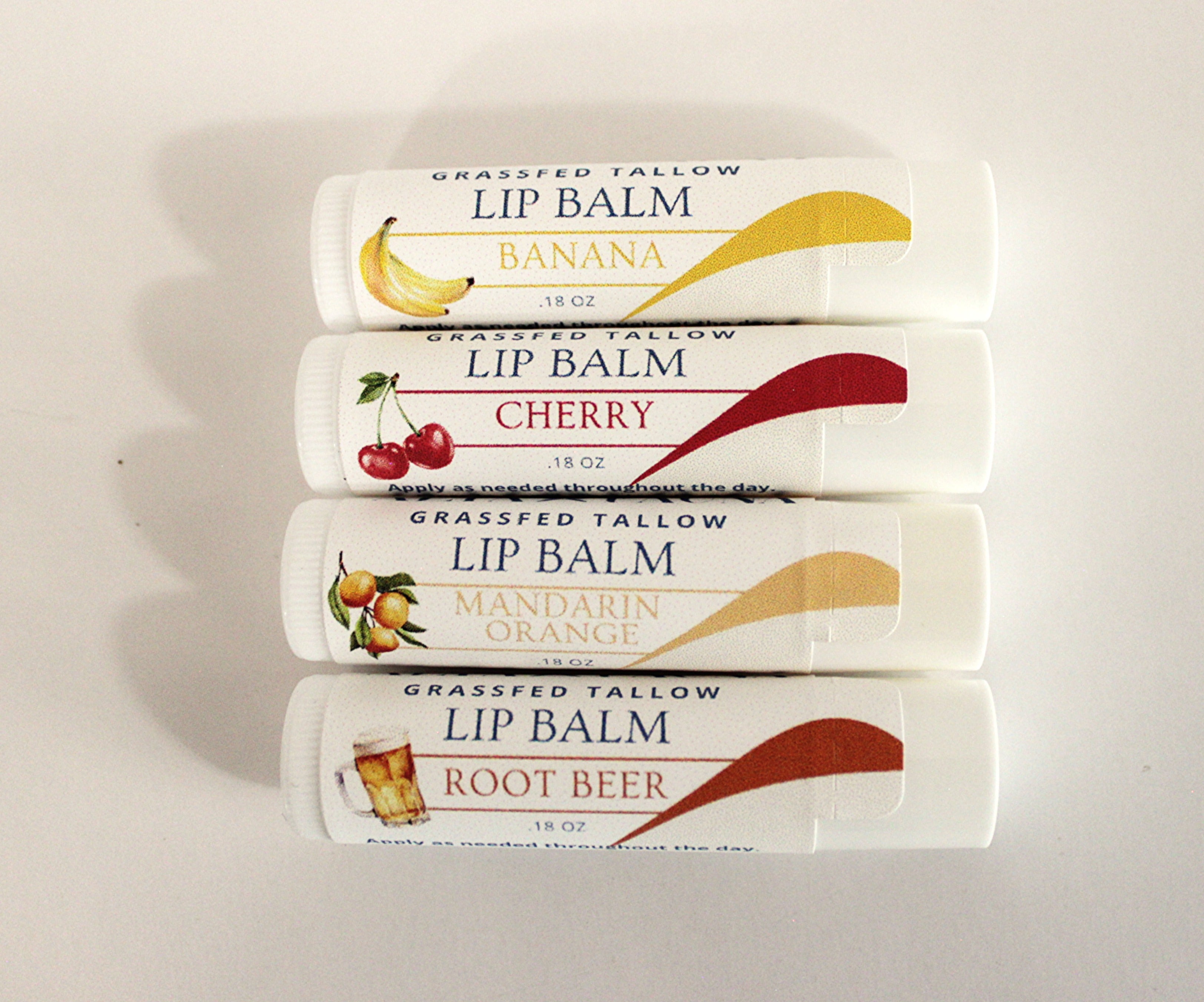 Photo of the Alta Fauna Edibles Lip Balms Bundle on a white background.  Selection includes Banana, Cherry, Mandarin Orange and Root beer.