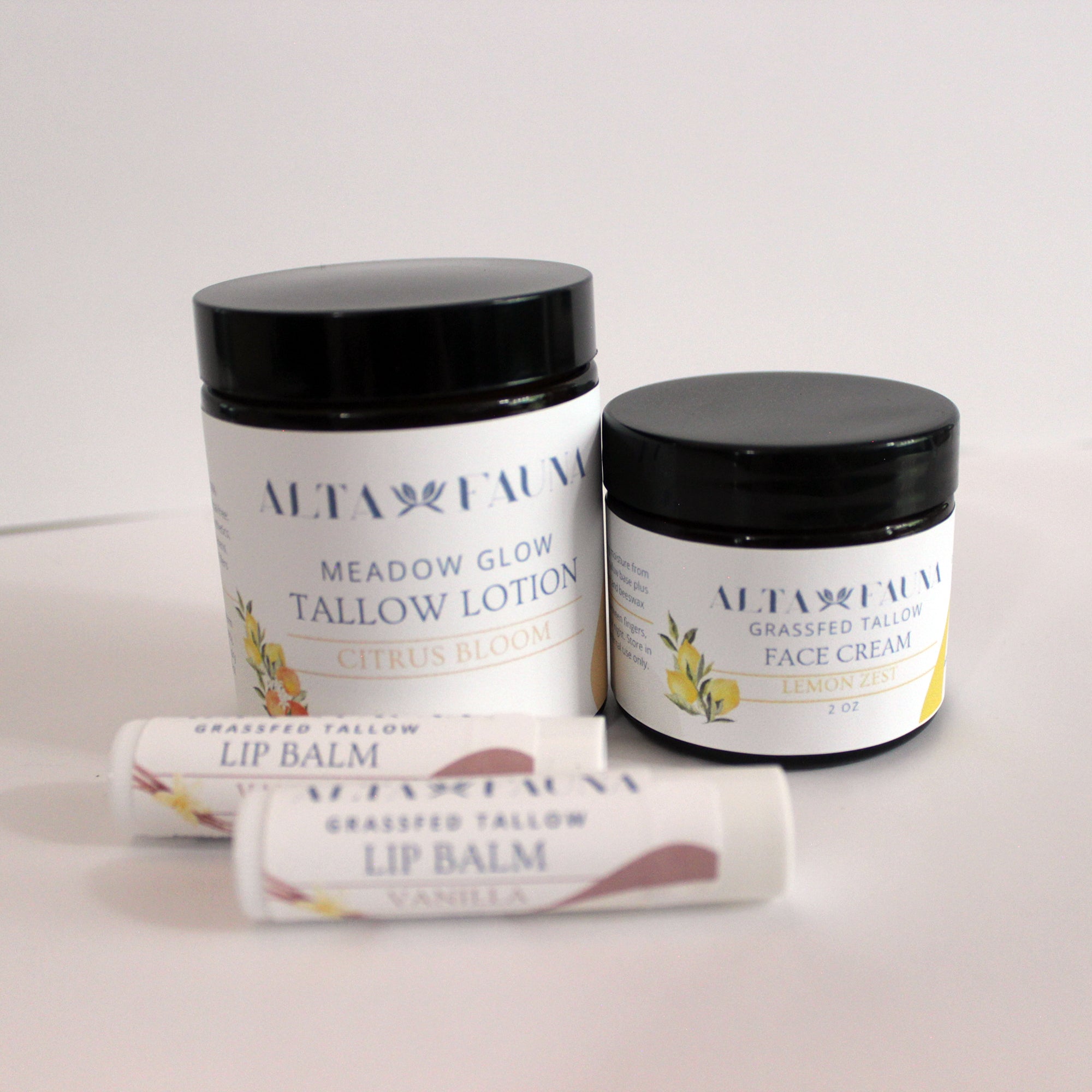 Alta Fauna Citrus Bundle with Tallow Lotion, Face Cream and Lip Balms on a white background.