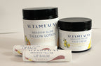 A curated set of Alta Fauna natural skincare products in citrus scents. Pictured are Tallow Lotion in Citrus Bloom, Lemon Zest Face Cream and two lip balms on a white background.