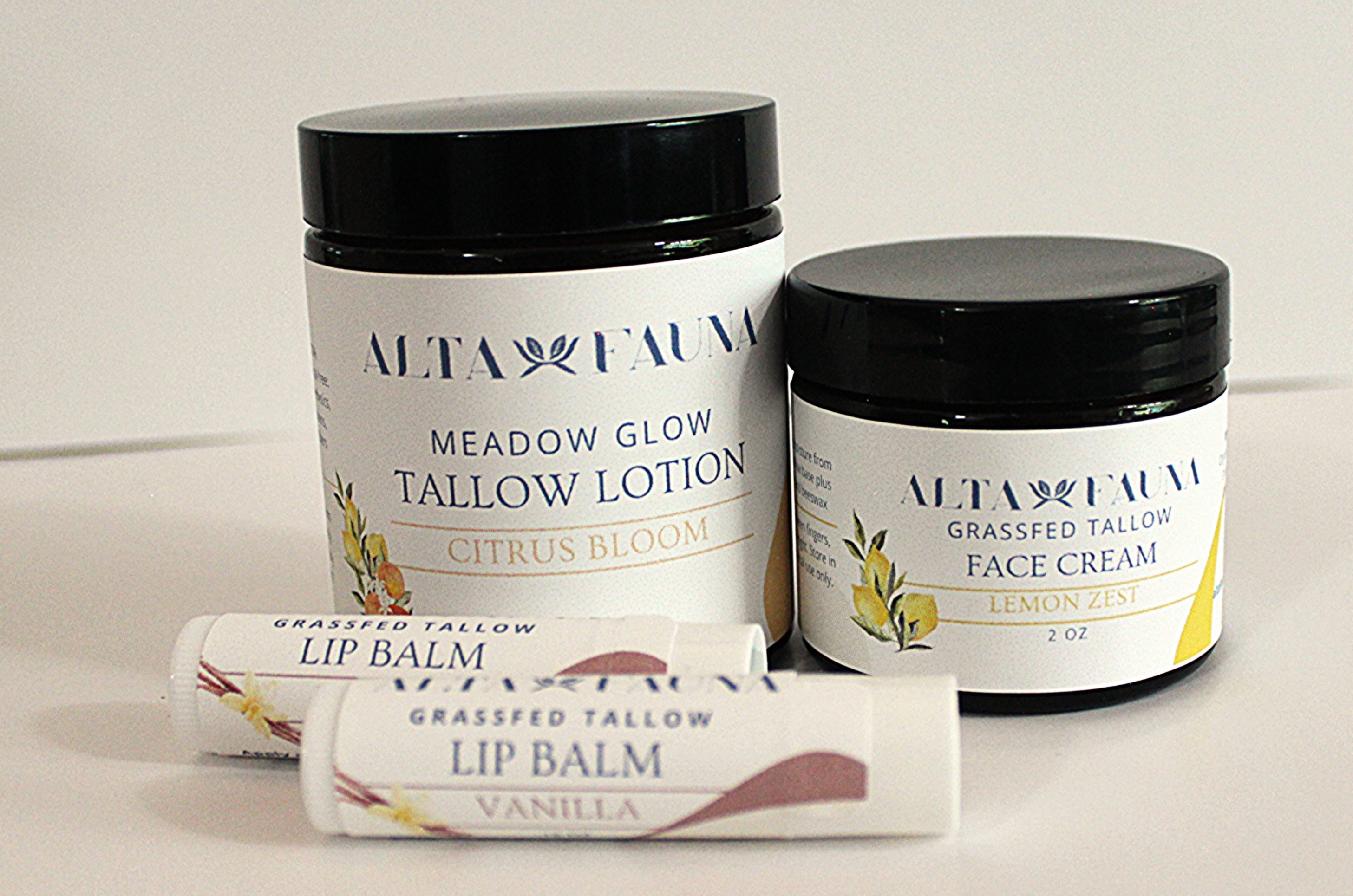 A curated set of Alta Fauna natural skincare products in citrus scents. Pictured are Tallow Lotion in Citrus Bloom, Lemon Zest Face Cream and two lip balms on a white background.