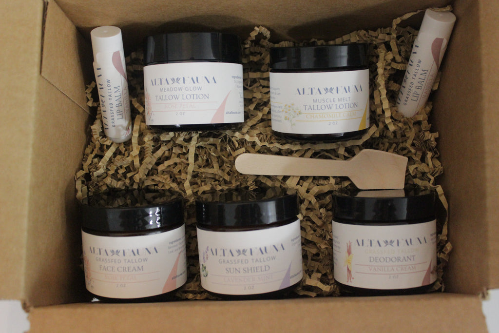 Alta Fauna Complete Bundle with tallow lotion, face cream, deodorant, sun shield, and lip balm arranged with a white background