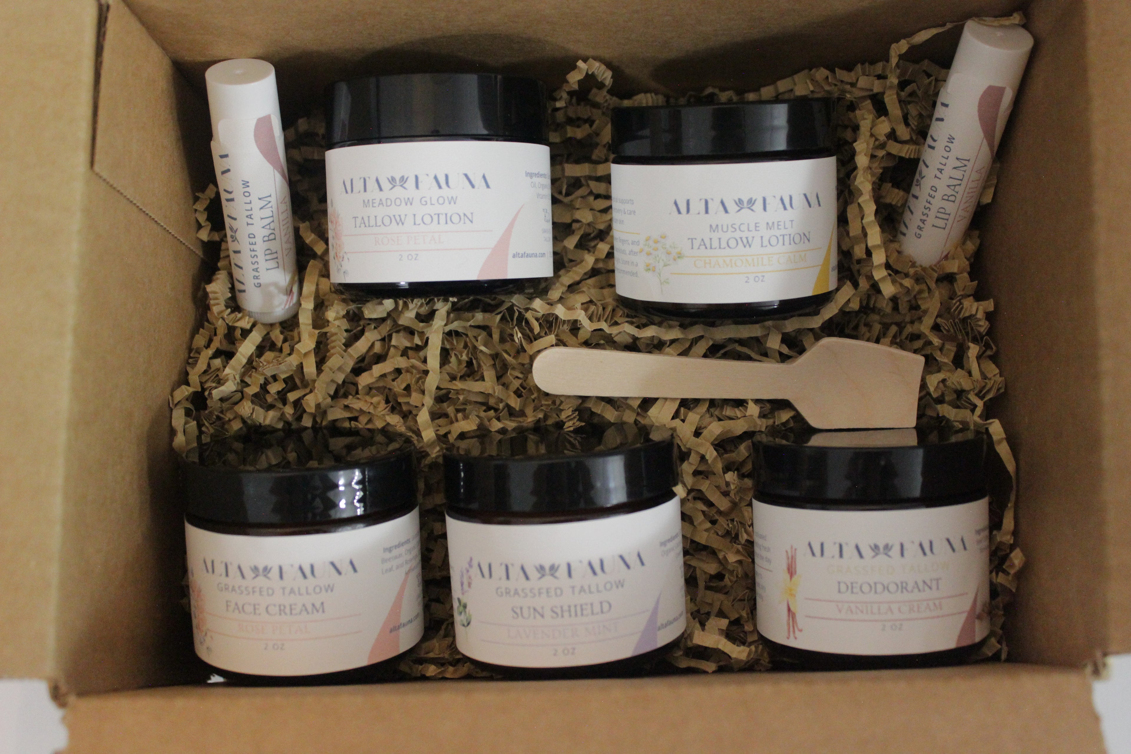 Alta Fauna Complete Bundle with tallow lotion, face cream, deodorant, sun shield, and lip balm arranged with a white background