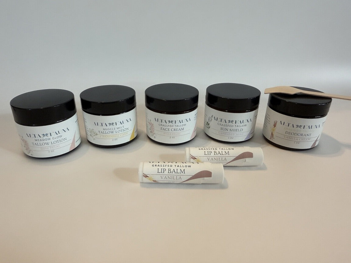 Alta Fauna Complete Bundle with tallow lotion, face cream, deodorant, sun shield, and lip balm arranged with a white background