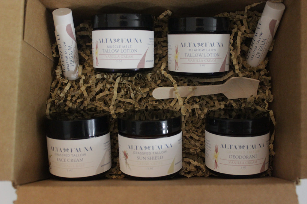 Alta Fauna Complete Bundle with tallow lotion, face cream, deodorant, sun shield, and lip balm arranged in a box