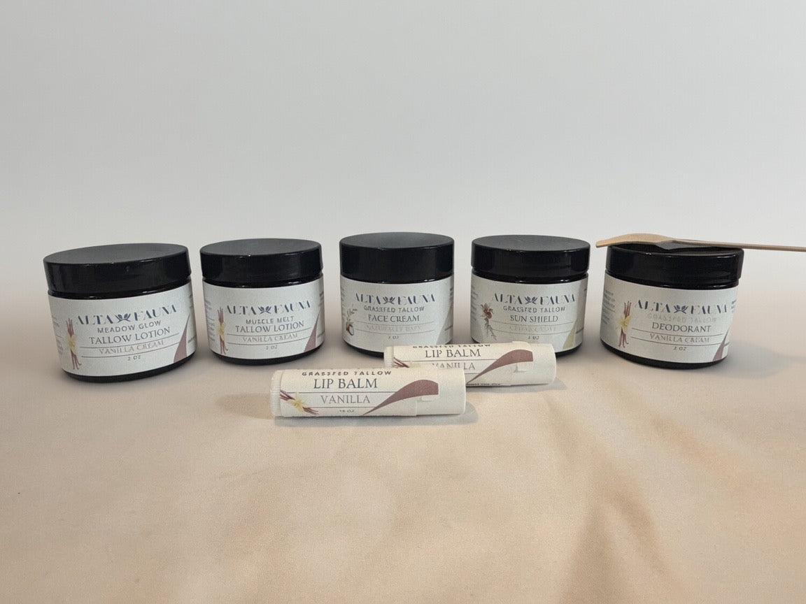Alta Fauna Complete Bundle with tallow lotion, face cream, deodorant, sun shield, and lip balm arranged with a white background