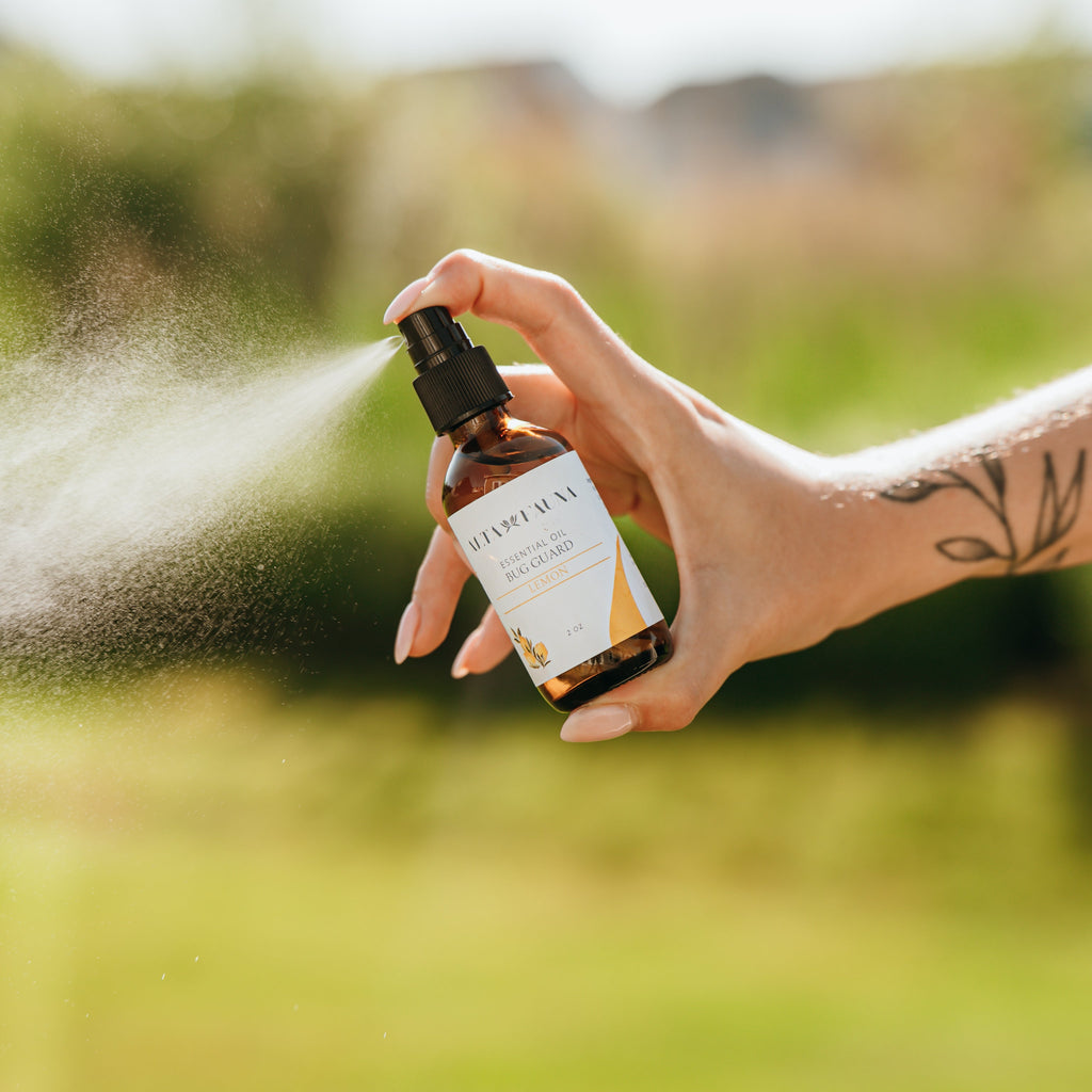 Alta Fauna Bug Guard natural insect repellent spray made with witch hazel and essential oils being sprayed outside, a fine mist is visible