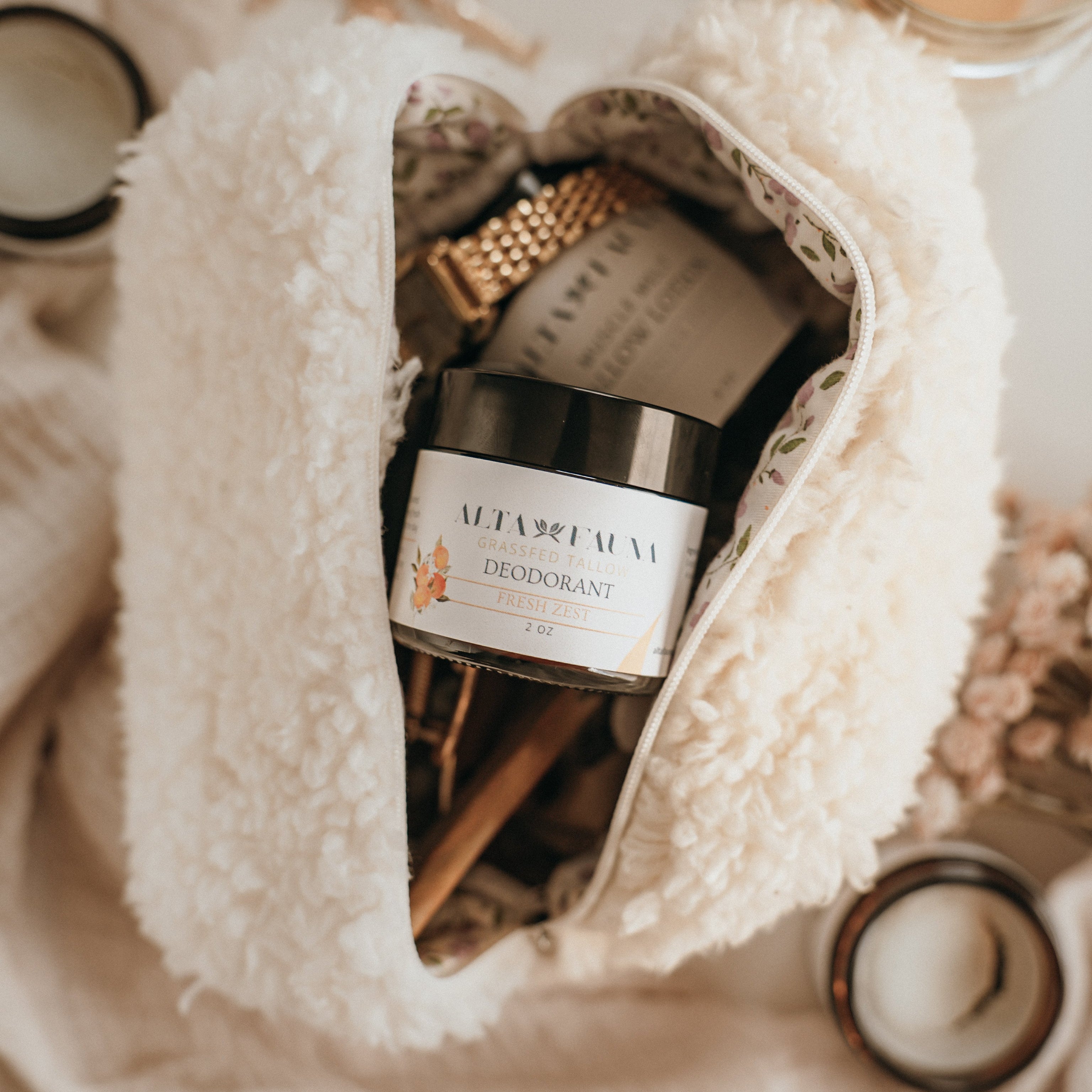 Close up of Alta Fauna natural deodorant in a beauty bag. Alta Fauna deodorant jar made with grassfed beef tallow and essential oils for gentle daily freshness