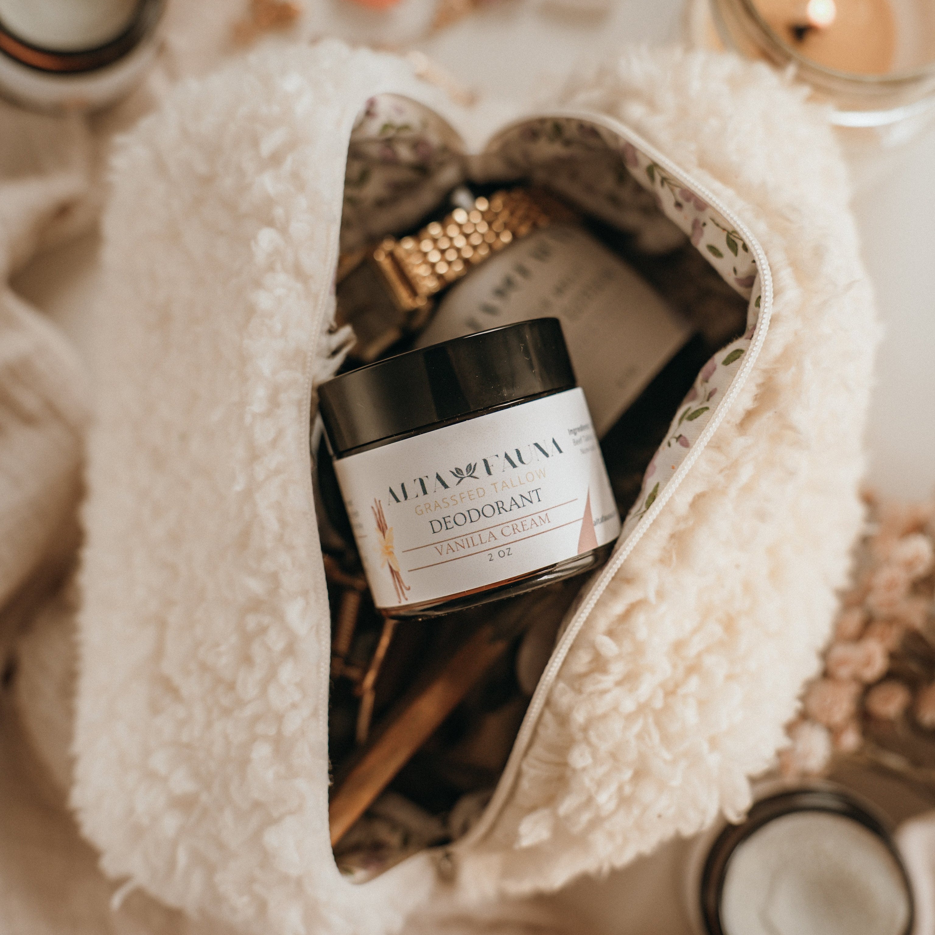 Close up of Alta Fauna natural deodorant in a beauty bag. Alta Fauna deodorant jar made with grassfed beef tallow and essential oils for gentle daily freshness