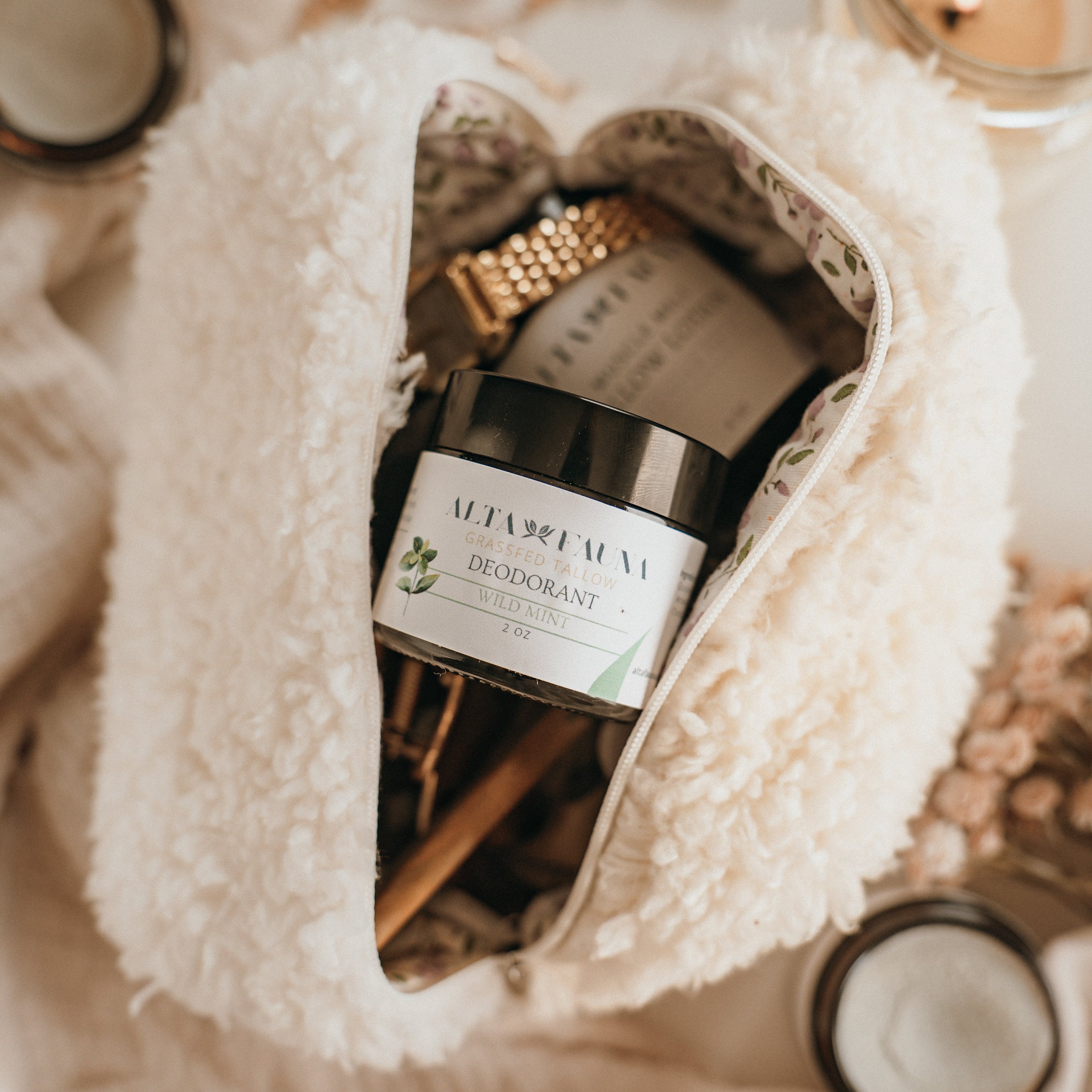 Close up of Alta Fauna natural deodorant in a beauty bag. Alta Fauna deodorant jar made with grassfed beef tallow and essential oils for gentle daily freshness