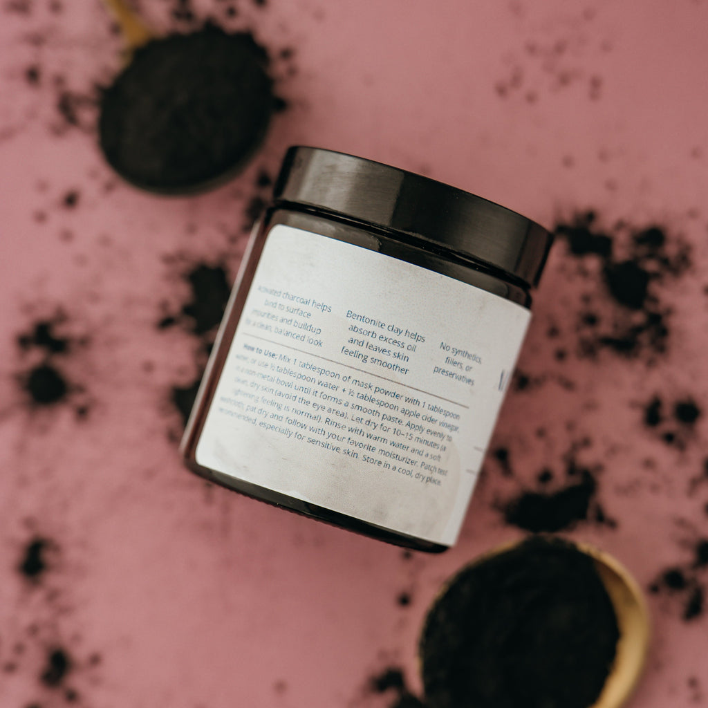 Jar of Alta Fauna Charcoal Face Mask showing the back of the label with description of ingredients and instructions on how to use. 