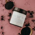 Jar of Alta Fauna Charcoal Face Mask showing the back of the label with description of ingredients and instructions on how to use. 