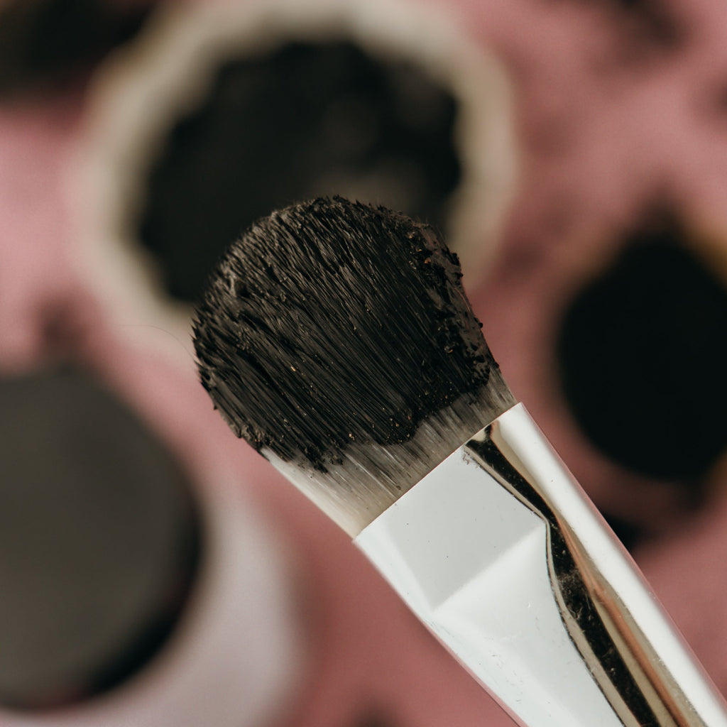 Alta Fauna charcoal and clay face mask on a brush