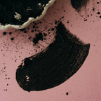 Smear of Alta Fauna moist face mask on pink background.