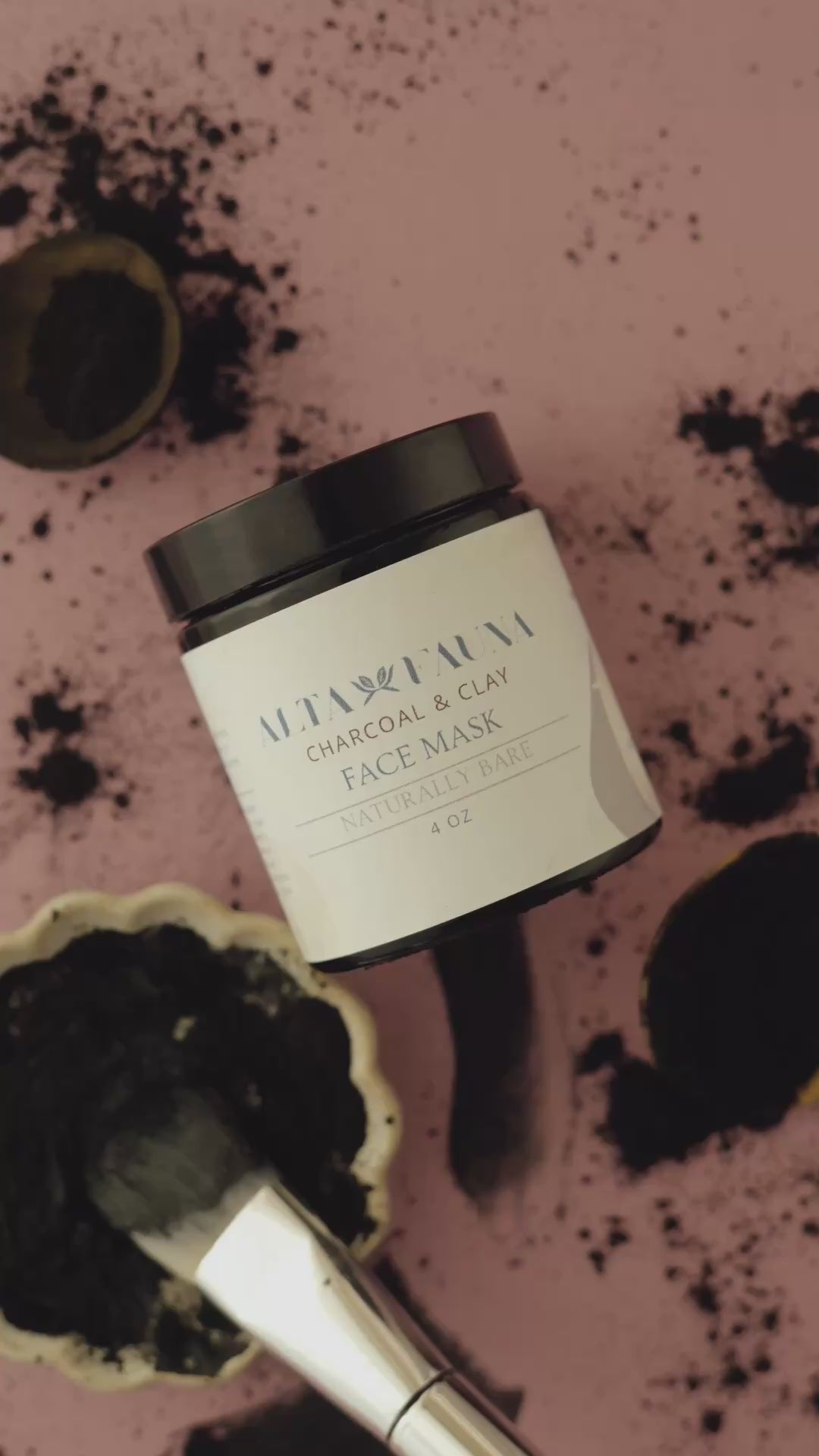Video of Alta Fauna Charcoal and Clay face mask on skin, in a spoon and in a dish. 